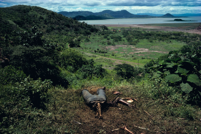 Susan Meiselas - Cuesta del Plomo, showing a body on a hillside outside Managua, a well known site of many assassinations carried out by the National Guard, Managua, Nicaragua, 1981