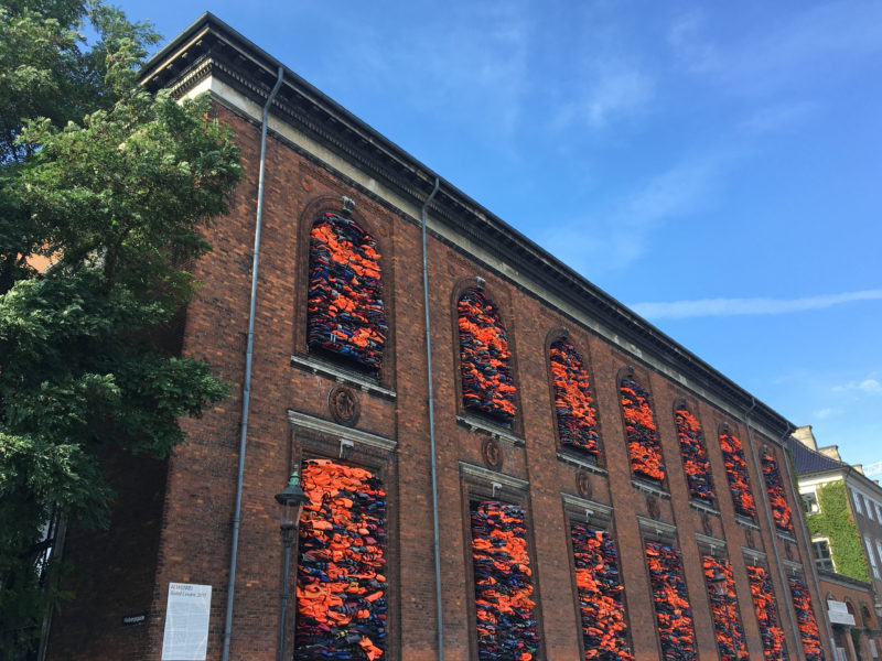 Ai Weiwei – Soleil Levant, 2017, life jackets in front of windows of facade, Kunsthal Charlottenborg, 2017