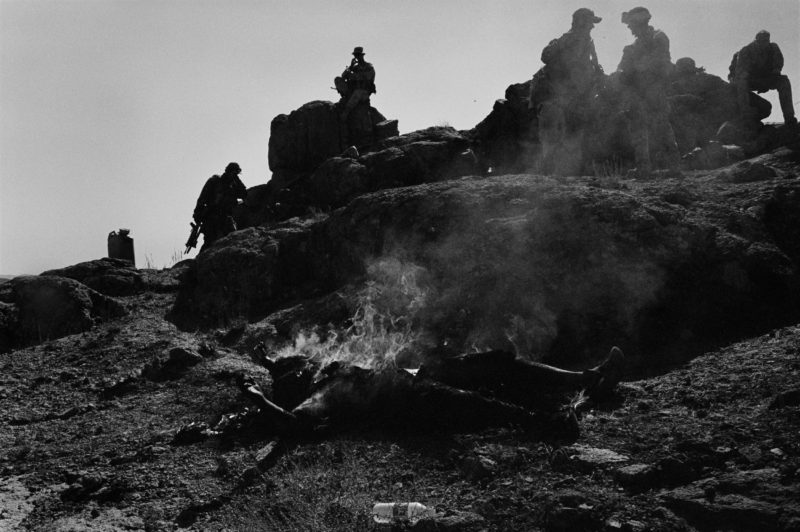 Stephen Dupont - During the war in Afghanistan in 2005, US soldiers of the 173rd Airbourne, seen above, burn the bodies of two dead Taliban militants in the village of Gonbaz, Afghanistan