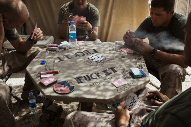Stephen Dupont – In the Khanashin fortress in Helmand province, Afghanistan, in 2009. The US Marines of the Delta Company, second reconnaissance battalion, play cards in their encampment.
