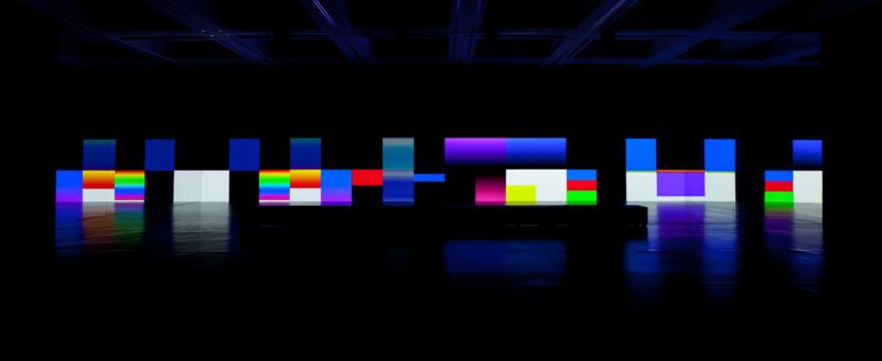 Carsten Nicolai – unicolor, 2014, DLP-projectors, DMX-LED lights, projection screen, mirrors, computer, sound, bench with loudspeakers