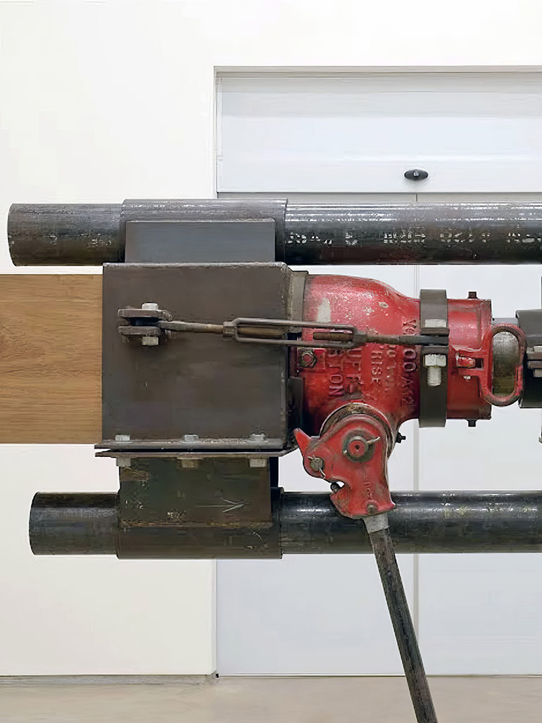 Chris-Burden-Samson-1985-turnstile-winch-worm-gear-leather-strap-jack-timbers-steel-steel-plates-dimensions-variable-installation-view-Inhotim-Museum-Brazil-feat