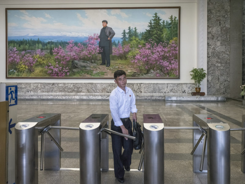 Carl De Keyzer - Entry to the Grand People’s Study House, Pyongyang. The painting in the background depicts President Kim Il Sung at Mt. Paekdu. 5 June 2017 3:00 PM