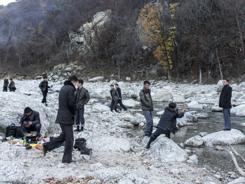 Carl De Keyzer - Mt. Myohyang, South Pyong’an Province. Preparing for a barbecue in a river bed. When traveling domestically and abroad, it is common for Koreans to travel with their work units, although travel with family and friends is now becoming more common. 31 October 2015 3:00 PM