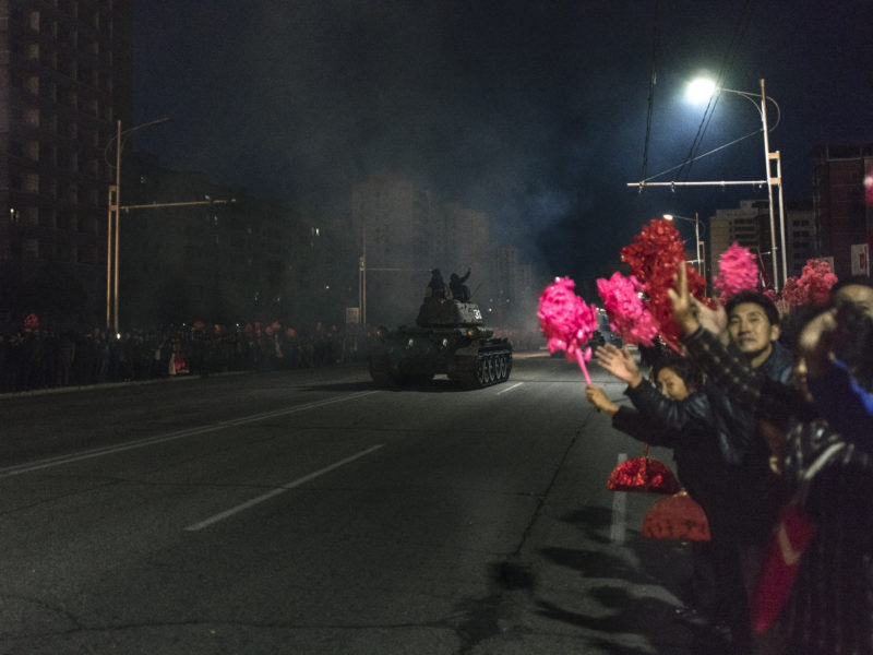 Carl De Keyzer - Party Foundation Day celebrations, Pyongyang. Soldiers of the Korean People’s Army leave the capital after a successful military parade. While soldiers are completely serious during the parade itself, they take on a relaxed and festive attitude once they have finished marching in formation. 10 October 2015 6:00 PM