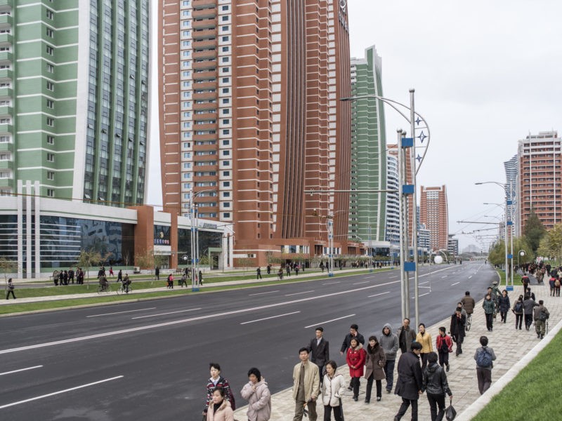 Carl De Keyzer - Pedestrians on Future Scientists Street, Pyongyang. This new residential district opened in 2015, and is reserved for scientists, academics, professors, and their families. 8 November 2015 4:00 PM