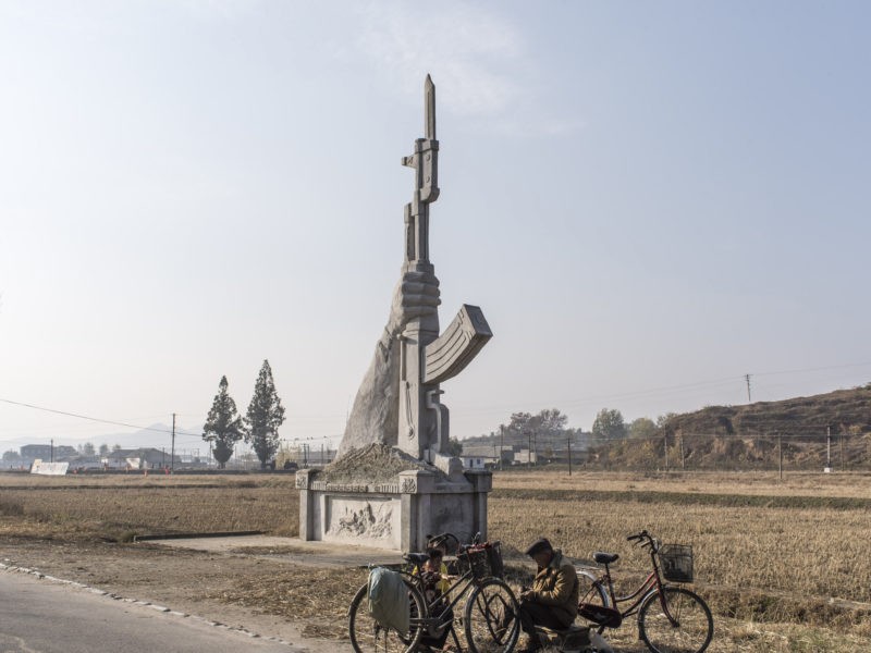 Carl De Keyzer - Roadside monument of an AK-47, near Kaesong. Political monuments are common, even in small towns and villages. 4 November 2015 2:00 PM