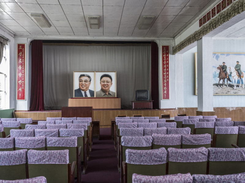 Carl De Keyzer - Seamen’s club, Nampo. Small theater used for performances and political meetings. The slogans on the sides say Long Live the Workers’ Party of Korea and Long Live the Democratic People’s Republic of Korea. 5 June 2017 5:00 PM