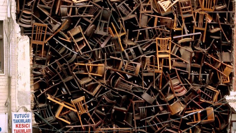 Detail of Doris Salcedo - Untitled, 2003, 1,550 wooden chairs, approx. 10.1 × 6.1 × 6.1 m (33 × 20 × 20 ft.), 8th International Istanbul Biennial, Istanbul, 2003