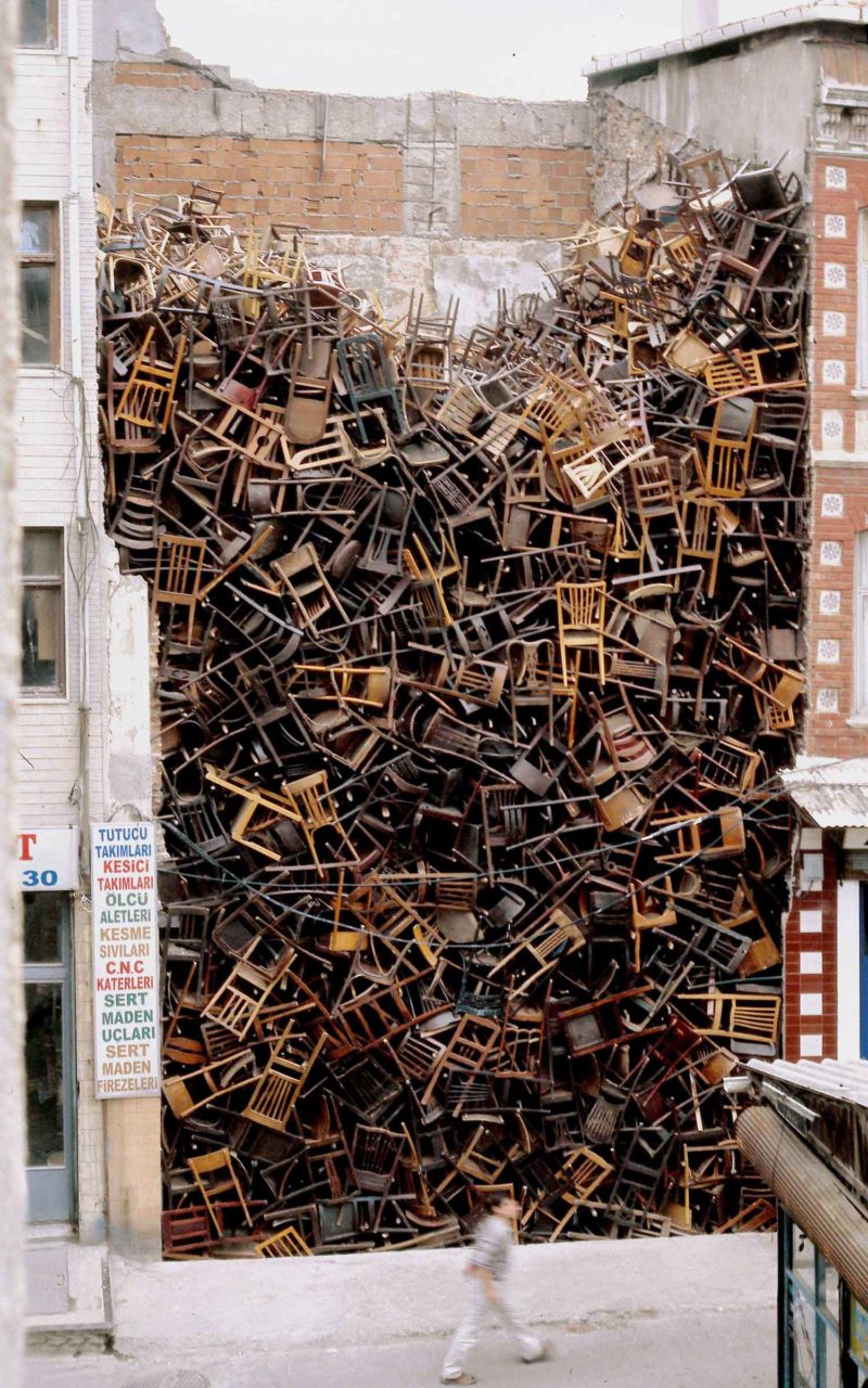 Doris Salcedo - Untitled, 2003, 1,550 wooden chairs, approx. 10.1 × 6.1 × 6.1 m (33 × 20 × 20 ft.), 8th International Istanbul Biennial, Istanbul, 2003