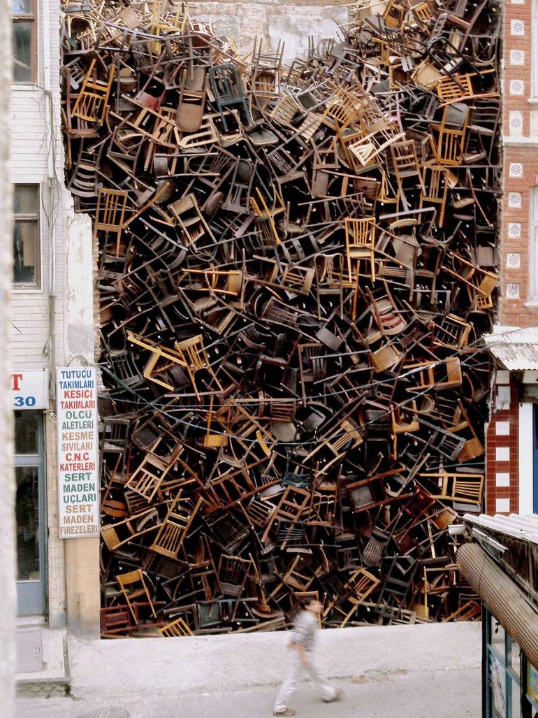 Doris Salcedo – Untitled, 2003, 1,550 wooden chairs, approx. 10.1 × 6.1 × 6.1 m (33 × 20 × 20 ft.), 8th International Istanbul Biennial, Istanbul, 2003 feat