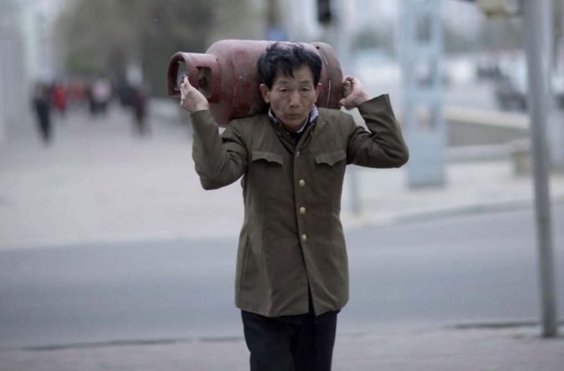 Eric Lafforgue – North Korea - It is forbidden to take pictures of the daily life of the North Korean people if they are not well dressed. For my guide this man was not well dressed enough to be photographed