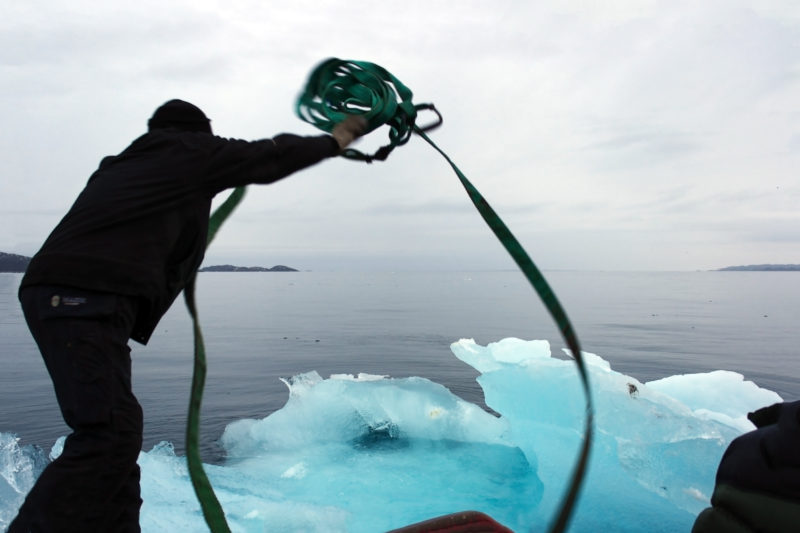 Harvesting ice through Nuup Kangerlua, Greenland, for Ice Watch in Copenhagen, 2014