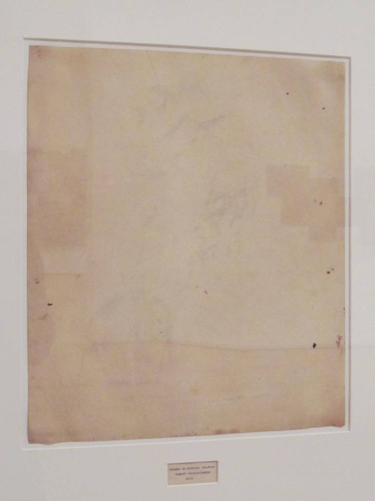 Robert-Rauschenberg-–-Erased-de-Kooning-1953-traces-of-drawing-media-on-paper-with-label-and-gilded-frame-64.14-cm-x-55.25-cm feat