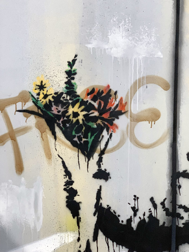 Detail of an unauthorized reproduction of Banksy's Flower Thrower