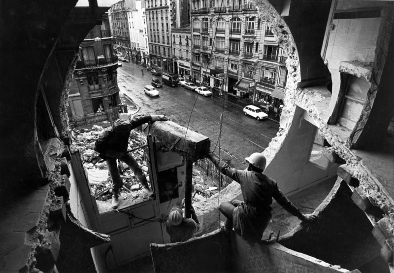 Gordon Matta-Clark and Gerry Hovagimyan working on Conical Intersect, 1975