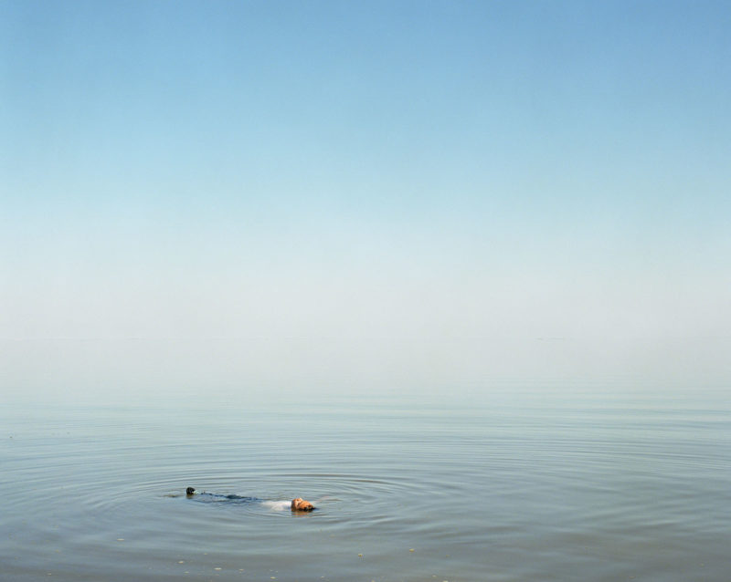 Ron Jude - Lago - Boy Floating in Water, 2012