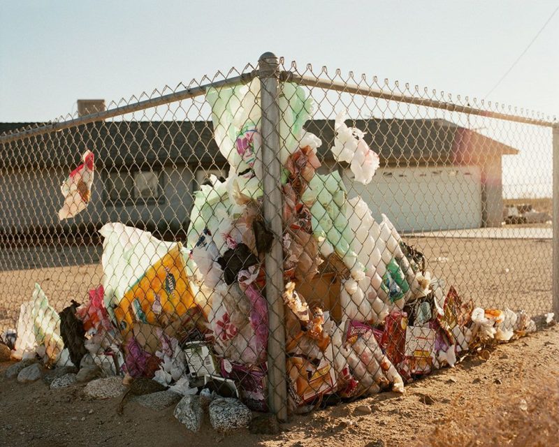 Ron Jude - Lago - Windblown Trash on Fence, 2014