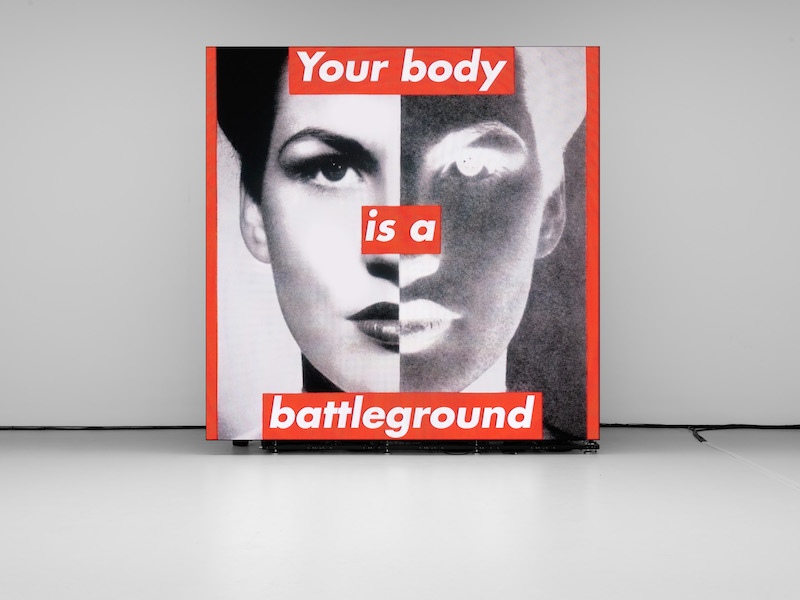 Barbara Kruger - Untitled (Your body is a battleground), 1989/2019, single-channel video on LED panel, sound, 1 min., 4 sec, 350.1 x 350.1 cm (137 7/8 x 137 7/8 inches), courtesy David Zwirner