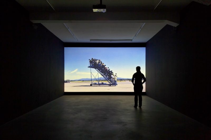 Adrian Paci - Centro di Permanenza Temporanea (Temporary Reception Center), 2007, 16:9 video projection, color, sound, 5’30’’, installation view, Galerie Peter Kilchmann, Zürich, Switzerland, 2007