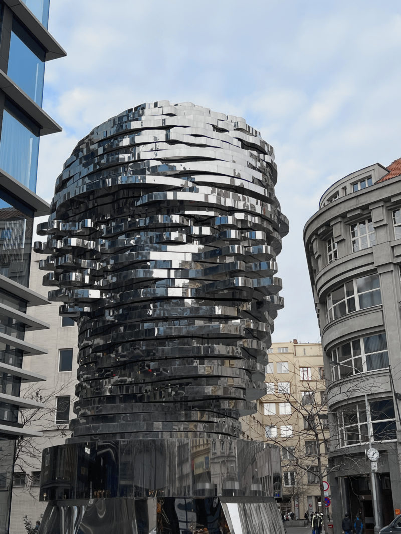 David Černý - Head of Franz Kafka, 2014, 40 layers of polished stainless steel, motors, electronics, 10.6 meters tall, 39 tonnes, installation view, Prague, Czech Republic