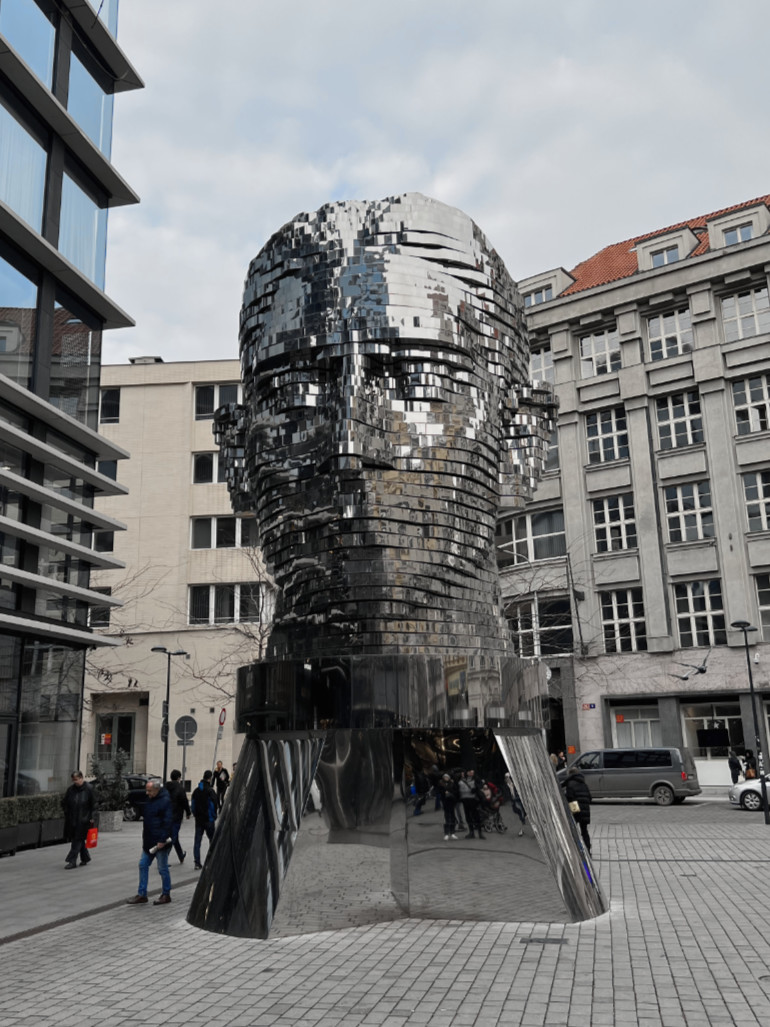 David Černý - Head of Franz Kafka, 2014, 40 layers of polished stainless steel, motors, electronics, 10.6 meters tall, 39 tonnes, installation view, Prague, Czech Republic feat