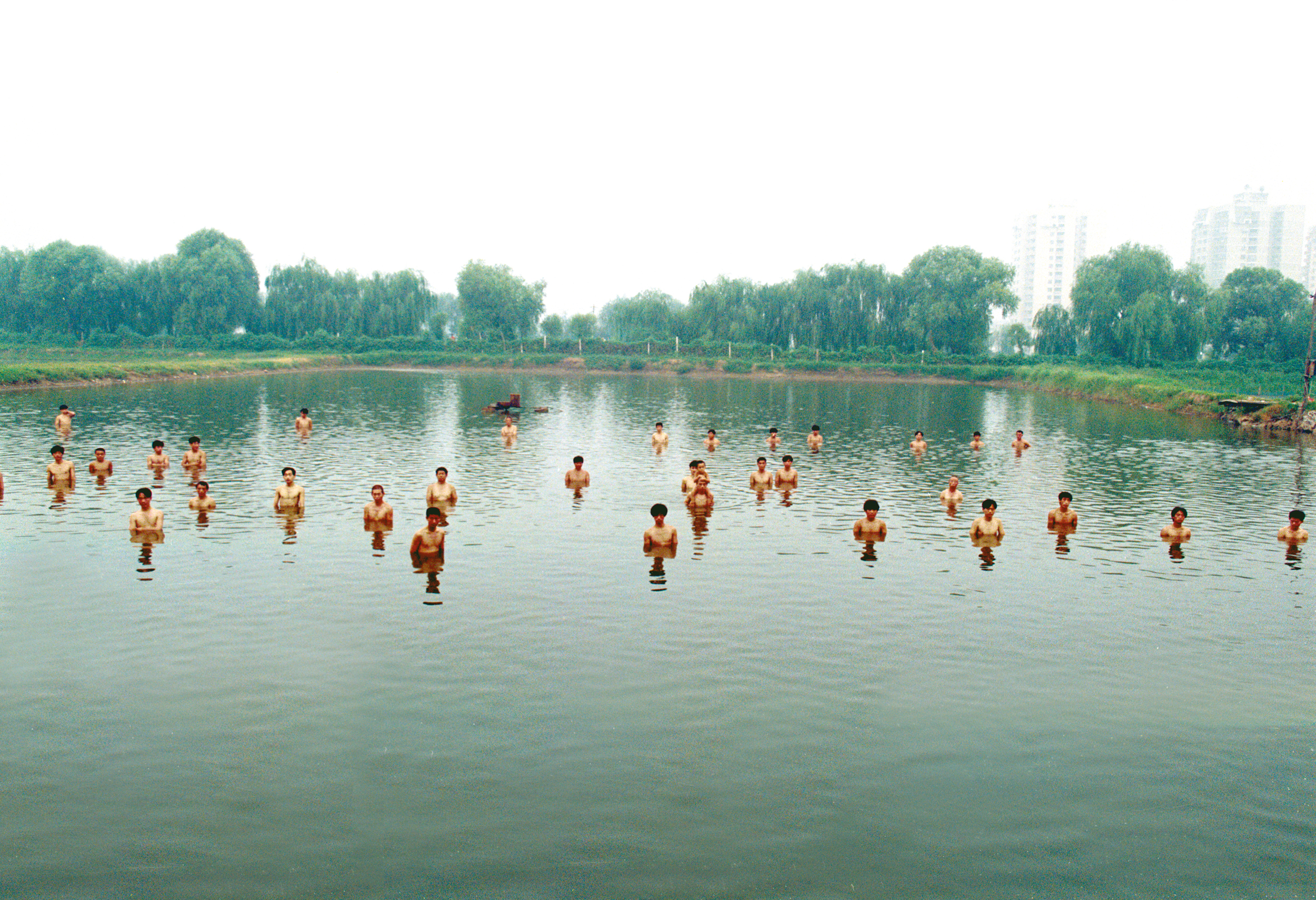 Zhang Huan – To Raise the Water Level in a Fishpond, 1997, 6 min 9 sec, Beijing, China