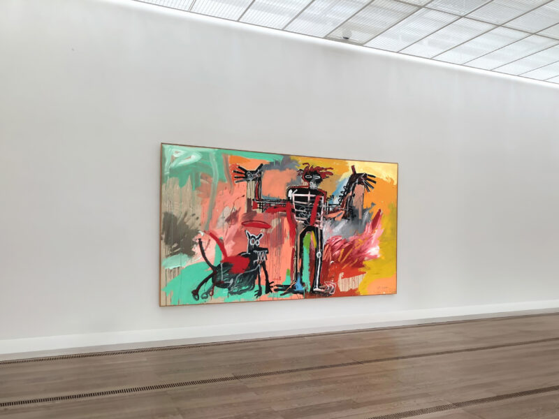 Jean-Michel Basquiat – Boy and Dog in a Johnnypump, 1982, acrylic, oil stick, spray paint on canvas, 240 x 420 cm (96 x 164 in), installation view, Fondation Beyeler, Switzerland, 2023