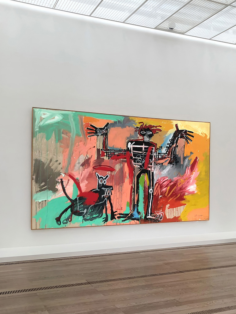 Jean-Michel Basquiat – Boy and Dog in a Johnnypump, 1982, acrylic, oil stick, spray paint on canvas, 240 x 420 cm (96 x 164 in), installation view, Fondation Beyeler, Switzerland, 2023 feat