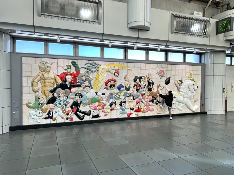 Tezuka Osamu - Characters on Parade, 2019, 460 ceramic tiles, 2.6 meters high, 8.8 meters wide, installation view, Kokusai-Tenjijō station, Kōtō, Tokyo, Japan