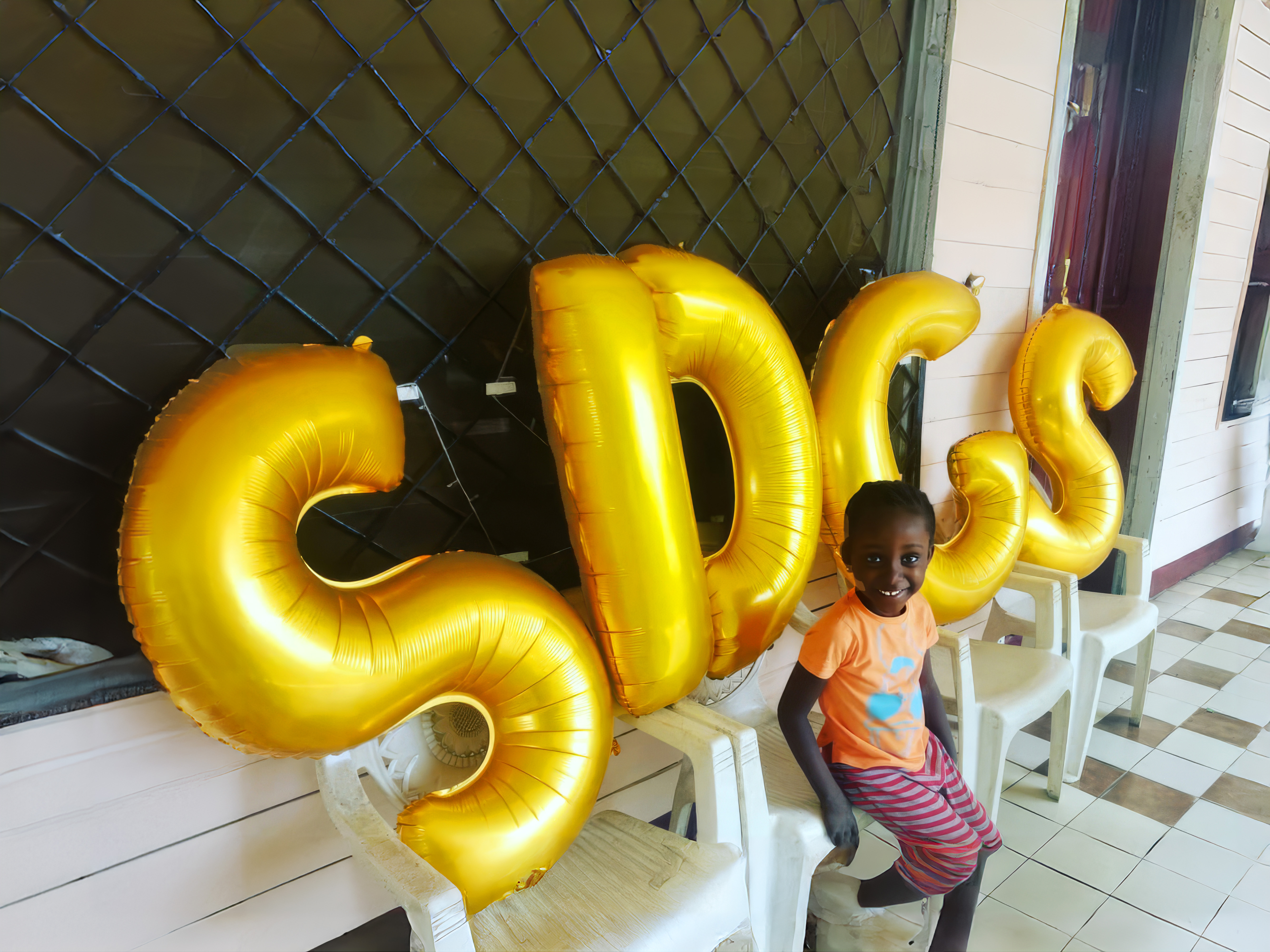 Cameroon, Limbe - SDGS, Silence Was Golden, gold balloons