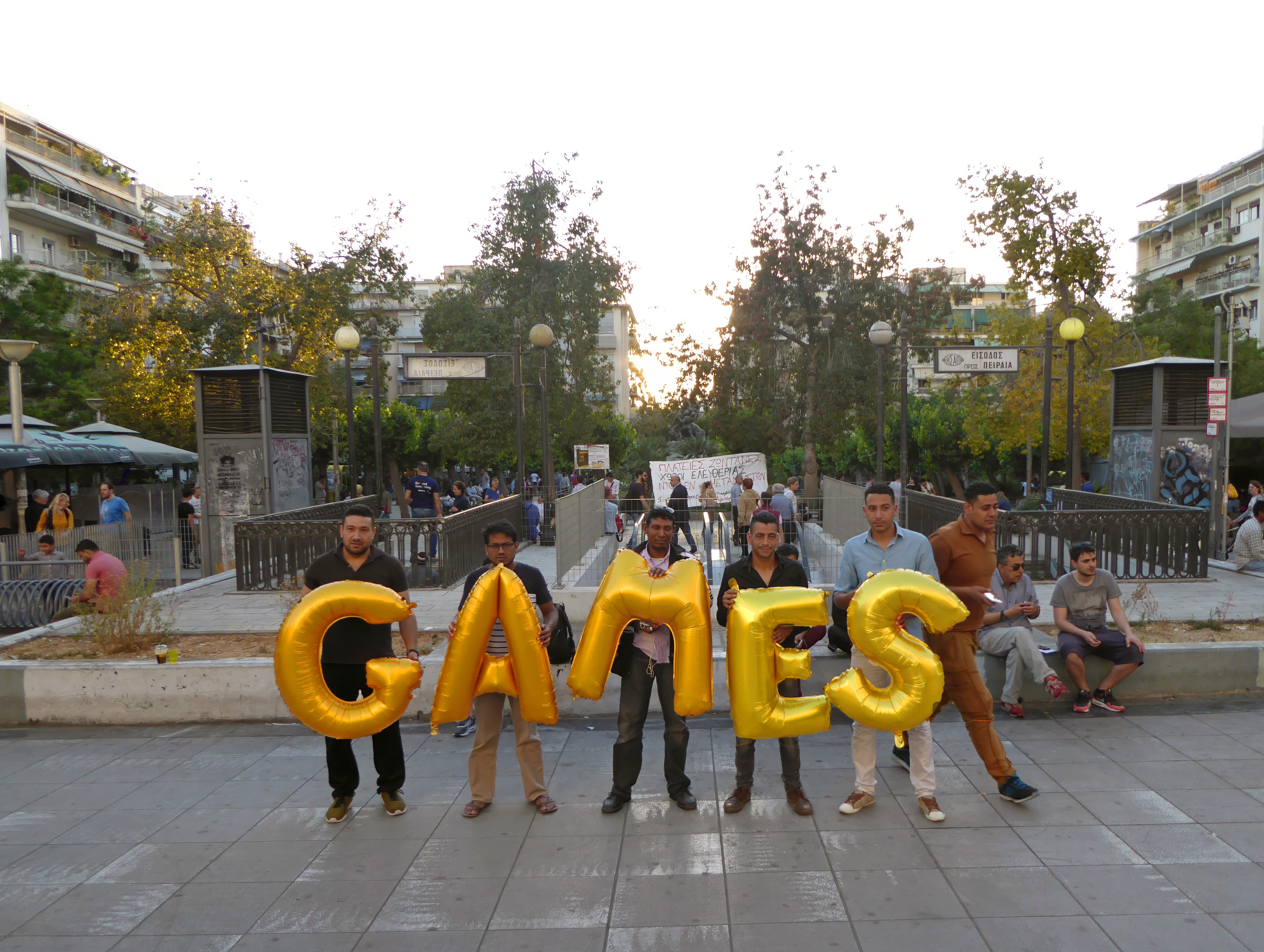 Greece, Athens, Viktoria Square (Πλατεία Βικτωρίας) - Games, Silence was Golden, gold balloons