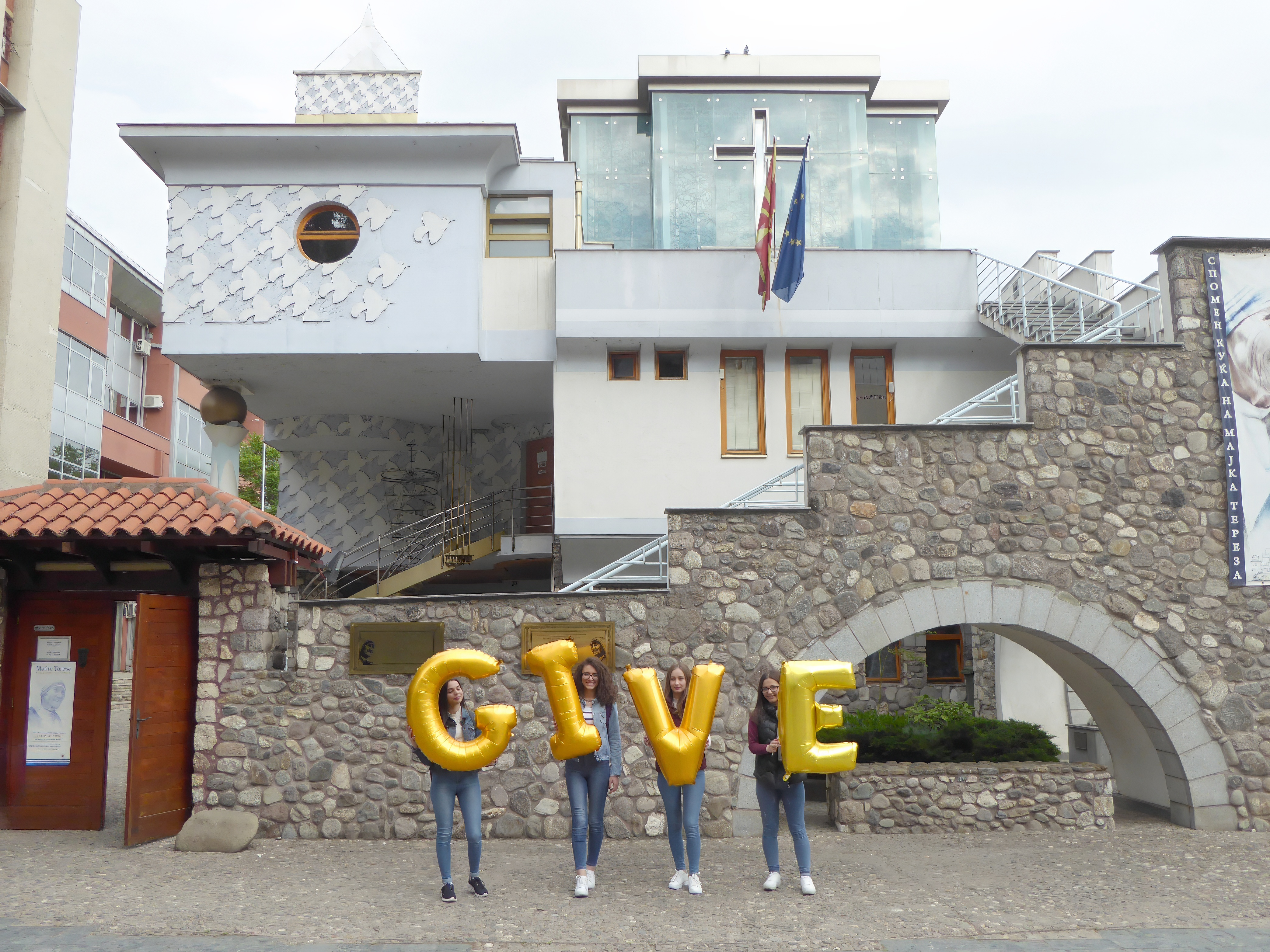 North Macedonia, Skopje, Memorial House of Mother Teresa (Shtëpia Përkujtimore e Nënë Terezës) - Give, Silence was Golden, gold balloos