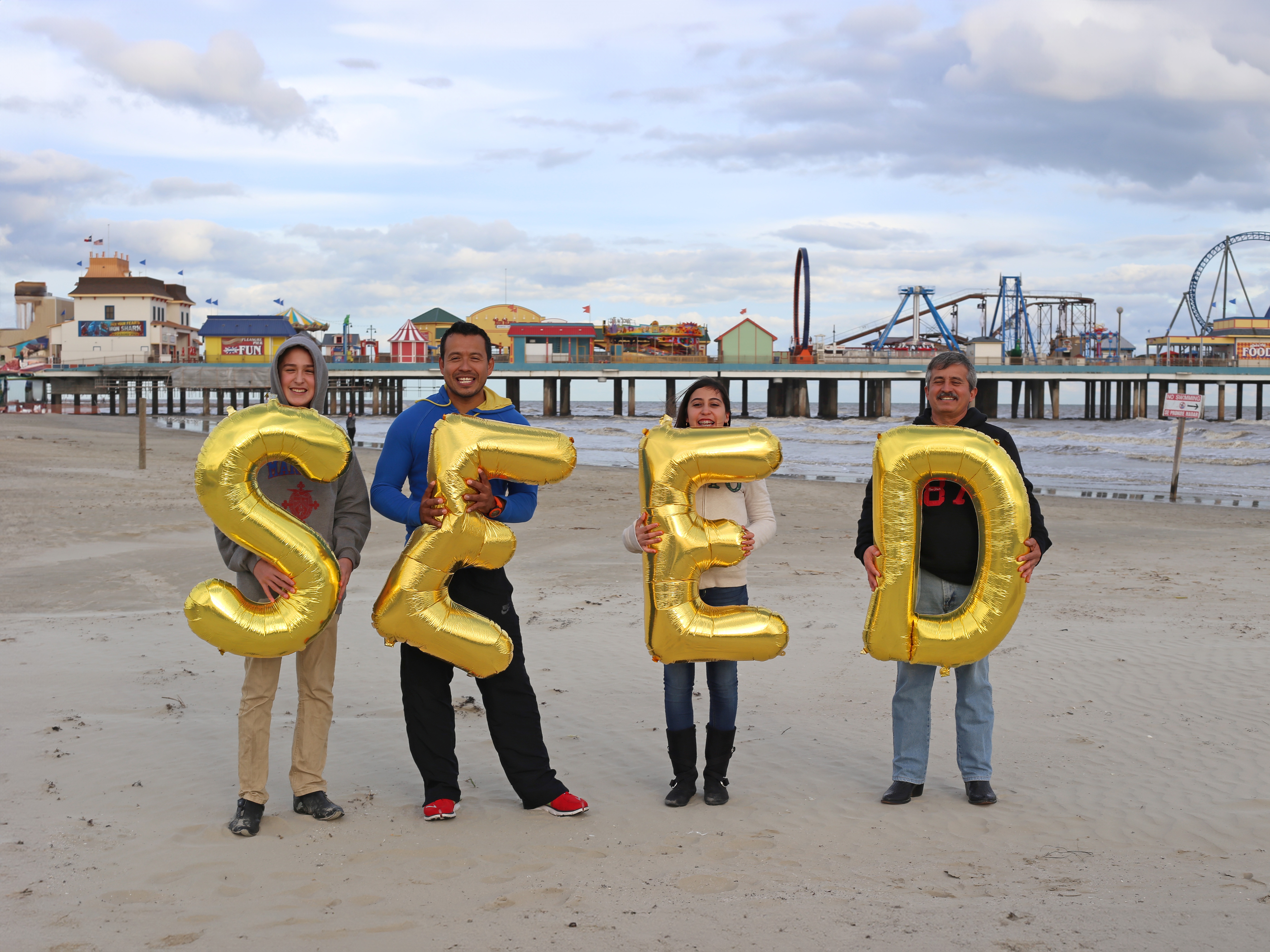 US, Galveston, Galveston Island Historic Pleasure Pier - Seed, Silence was Golden, gold balloons